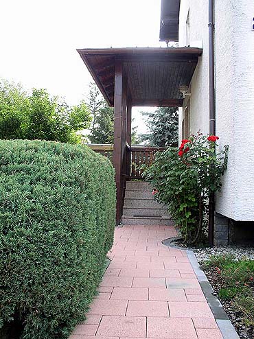 entrance to the house and paved path