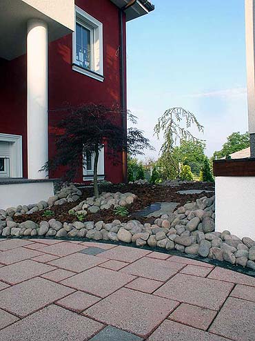 garden on a slope with pebbles